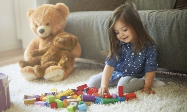little-girl-playing-with-toys-li 385X257